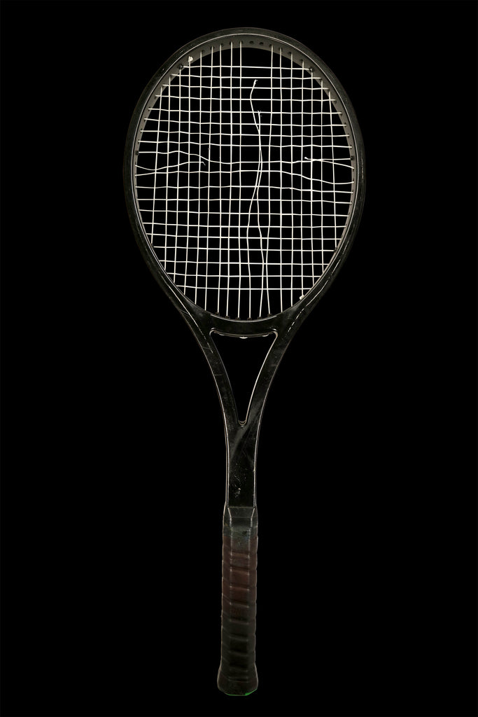 The original racquet before its strings were removed and inlaid into our watch dials