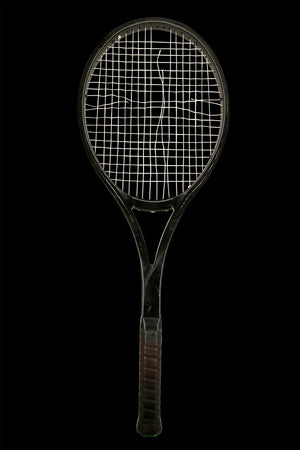 The original racquet before its strings were removed and inlaid into our watch dials
